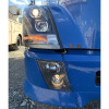 Lit Volvo VNL Blackout Projection Headlights With LED Bar 2004 & Newer Angle View Driver On Truck