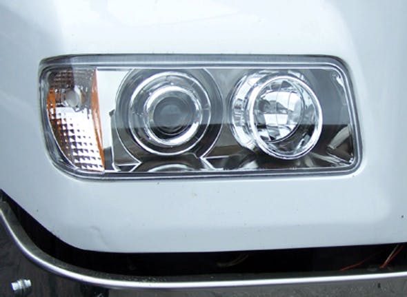 Freightliner FLD 120 112 Projector Headlights On Truck Close Up
