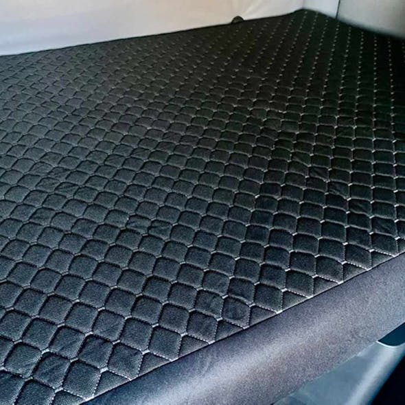 https://raneys-cdn11.imgix.net/images/stencil/original/products/210466/204521/V-Truck-Mattress-Cover-Black-Installed-Angle__81971.1702651957.jpg?auto=compress,format&w=590