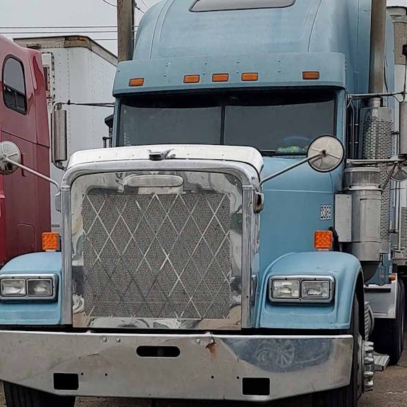 Freightliner Classic FLD 120 Round Hole Punch Grill Insert With Cross Stitch Pattern - installed